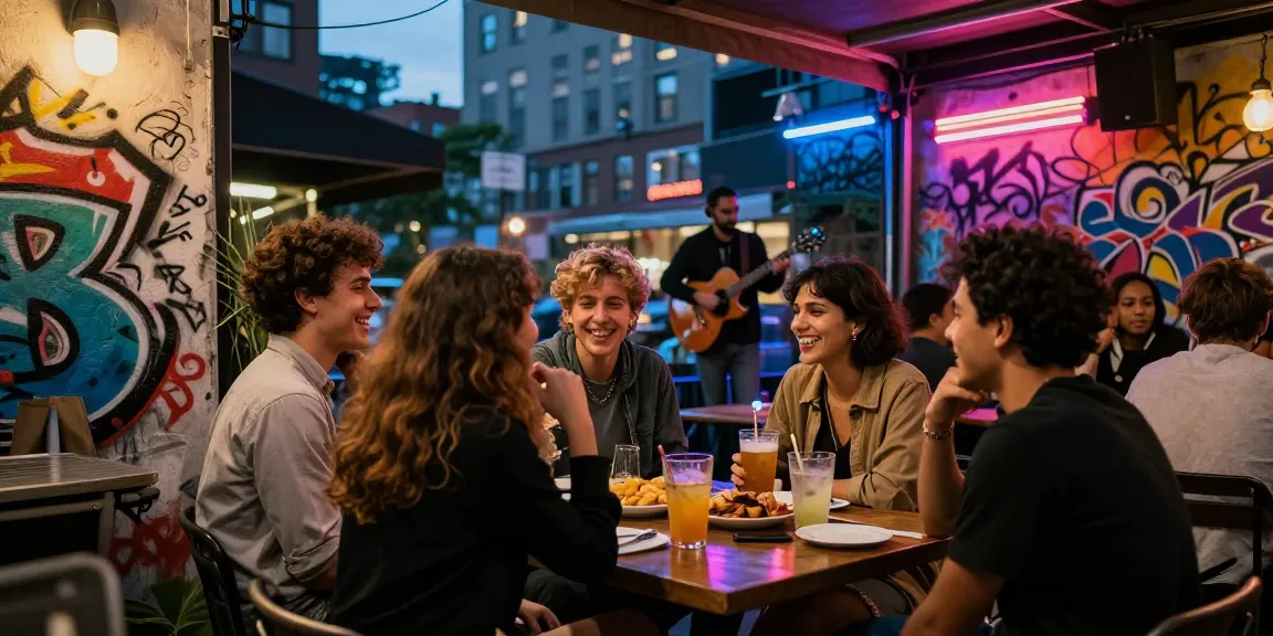 Nhóm gái gọi vui vẻ tại quán cà phê ngoài trời, ánh đèn neon sáng rực rỡ.